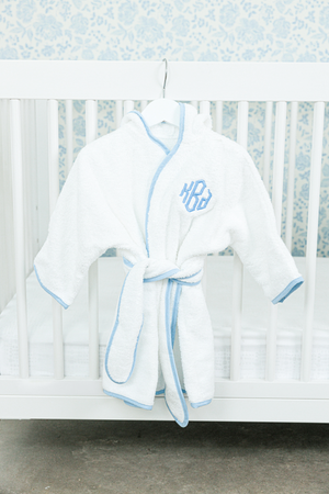 White baby robe with light blue trim