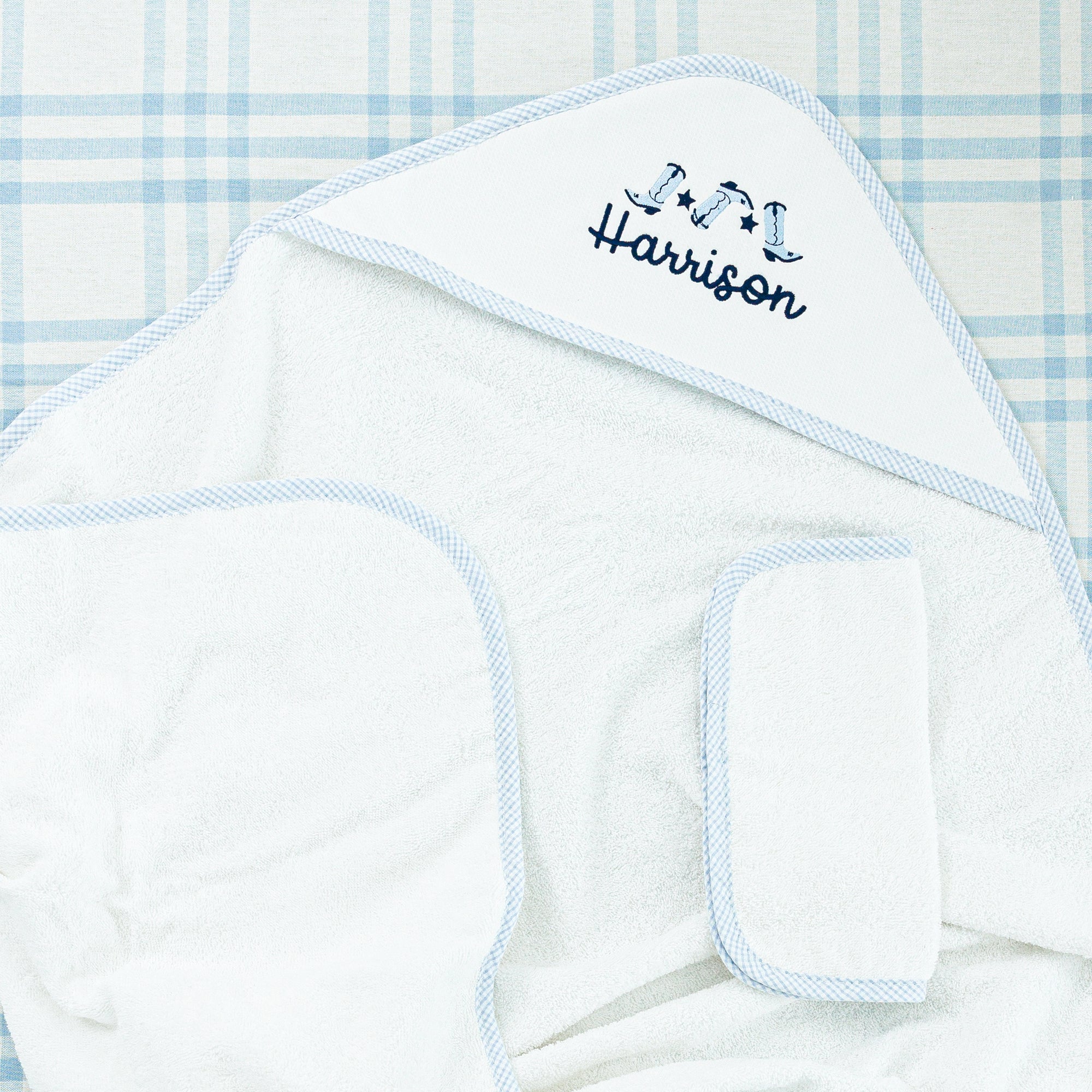 Soft hooded towels with gingham trim, perfect for keeping babies warm and cozy after bath time