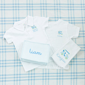 White polo shirt and t-shirt set with personalized embroidery featuring a golf cart design