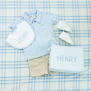 Blue striped polo shirt with matching bib and personalized pouch