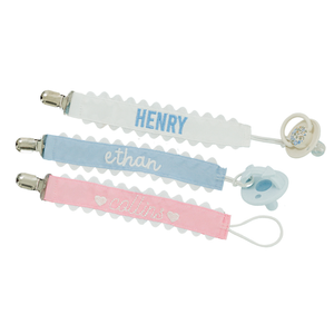 Set of three pastel-colored pacifier clips with rickrack trim.