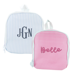 Two personalized children's bags: a blue-striped bag and a pink gingham bag with a bow design.